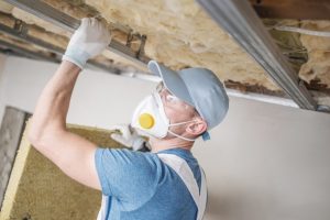 Man checking the insulation