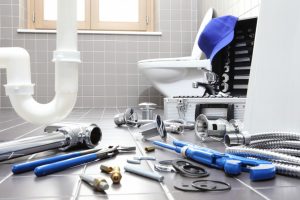 Plumber tools and equipments in a bathroom