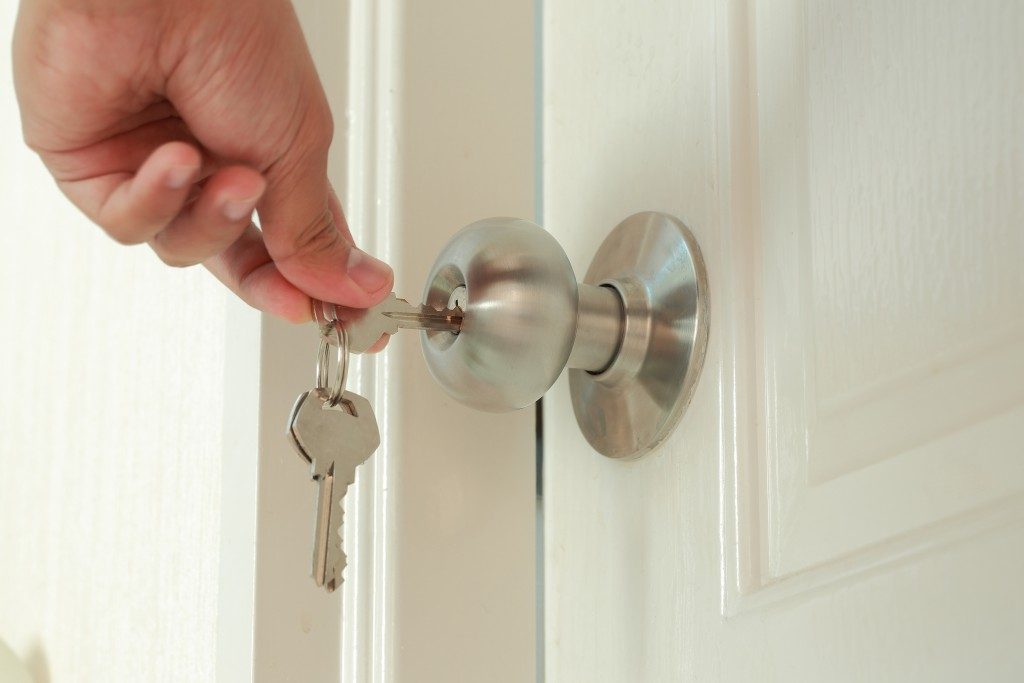 Person unlocking a door