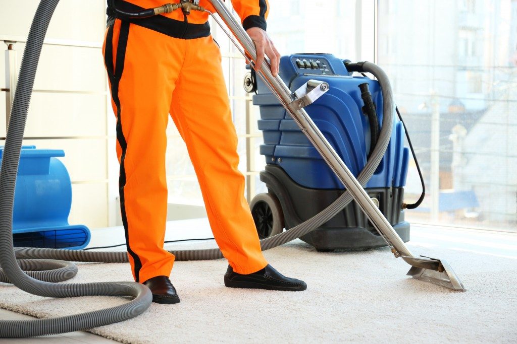 Man cleaning the carpet