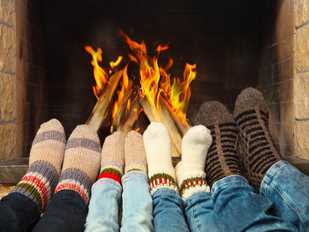 feet wearing socks in the fire