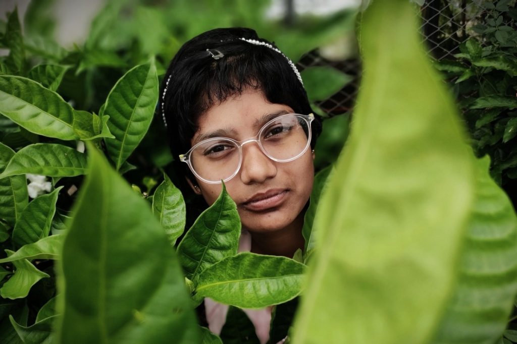 woman amongst some plants