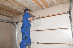 Man installing insulation panels to the walls