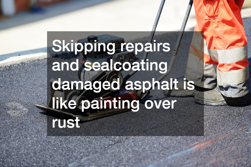 contractor smoothing out asphalt
